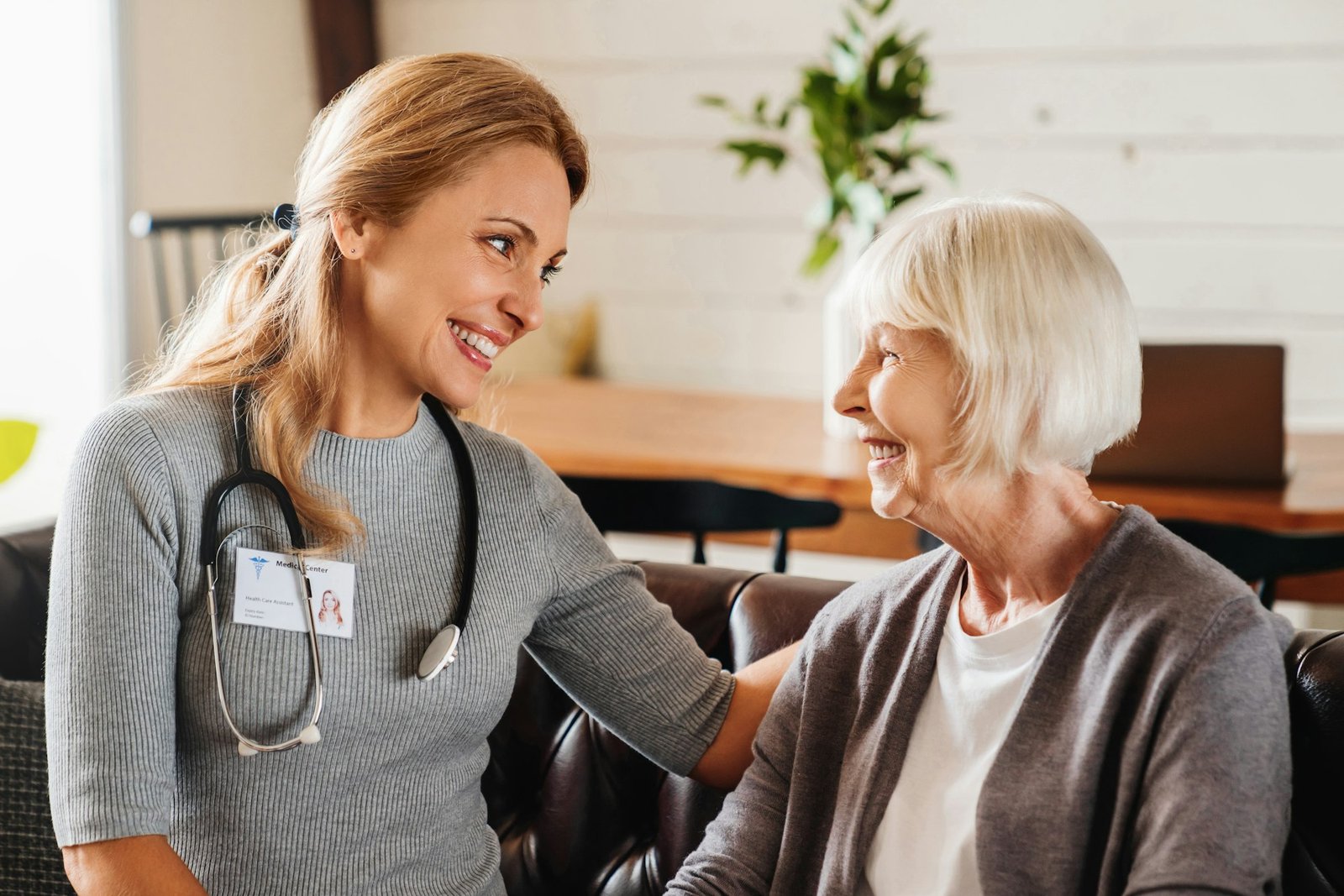 Home care nurse visits old woman patient